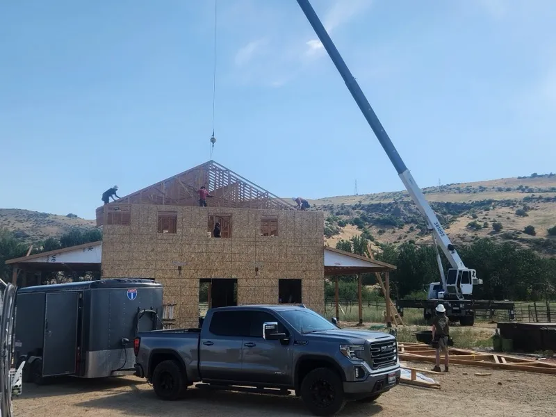 Housing prototype under construction with crane